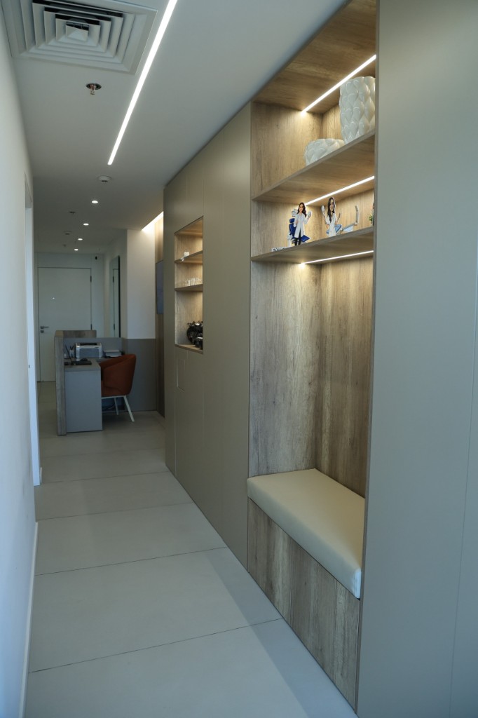 Lit hallway with a bench outside the treatment rooms