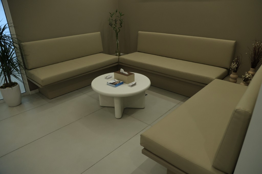 Waiting lounge corner with a plant and built-in seating